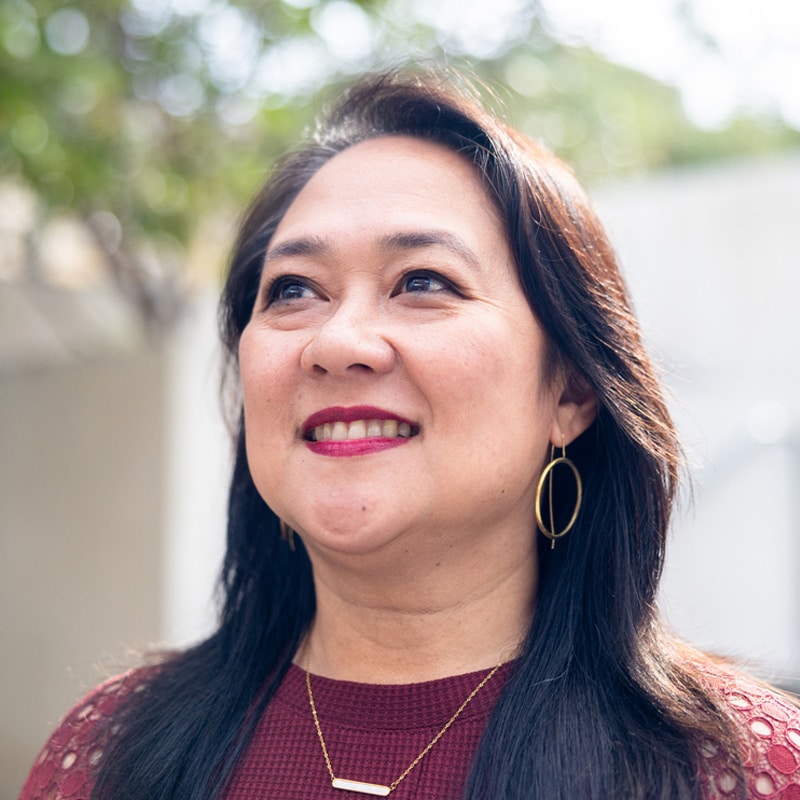 a woman smiling for the camera