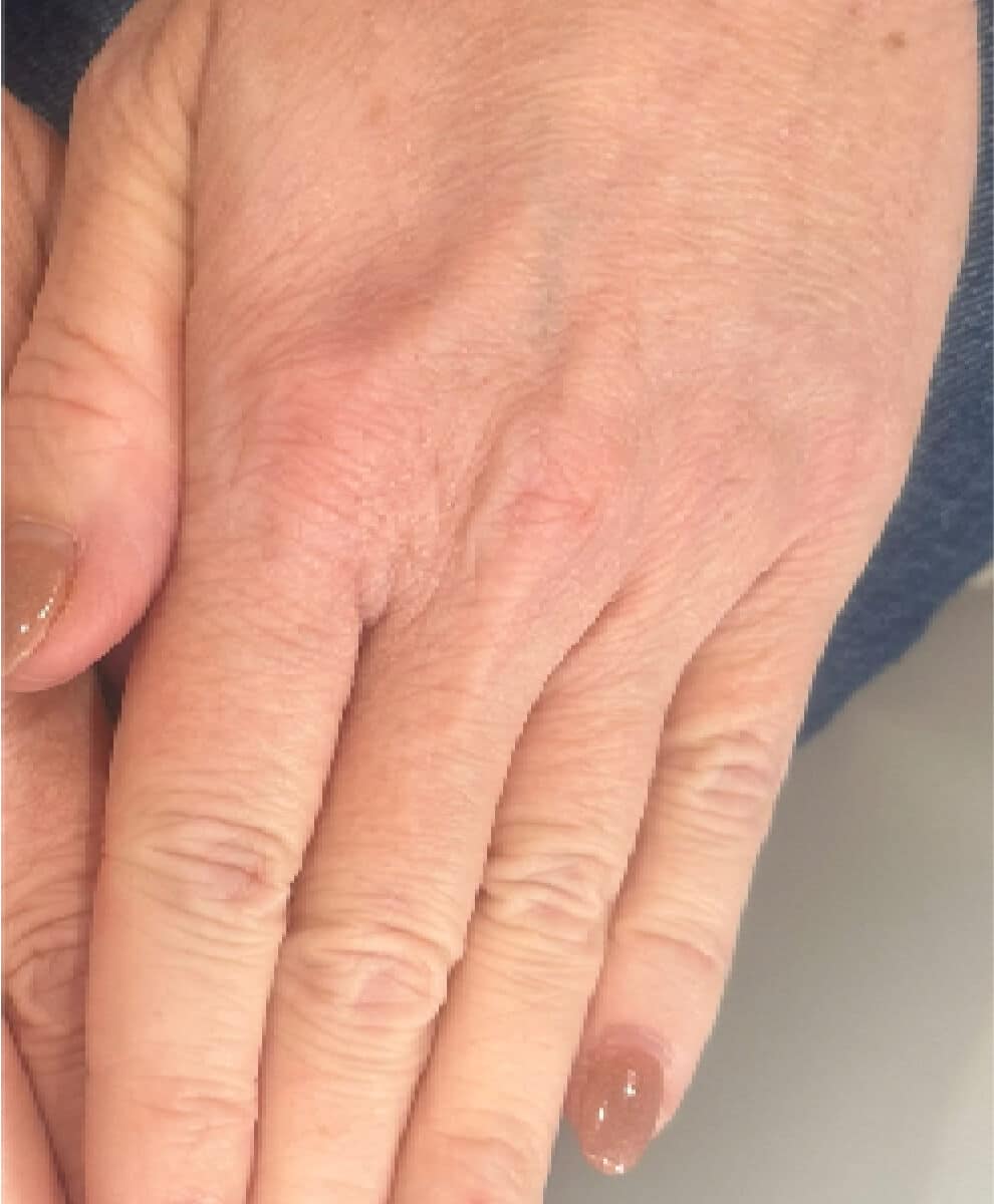 a hand holding an object in his hand